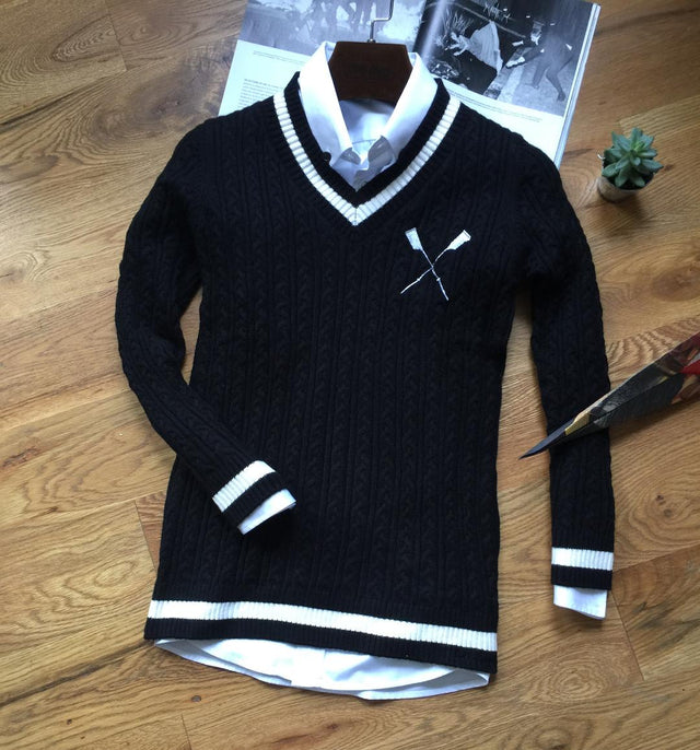 Adé Lang  black crossed white oar sweater in cable-knit pattern